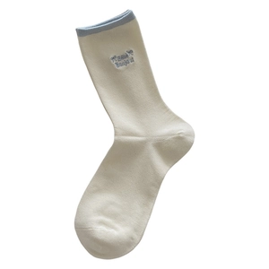 Mid-calf cotton socks with blue Bonjour embroidery and bow detail on cream fabric