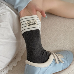 Japanese style grey cotton mid-calf socks with striped cuffs and dog woven label