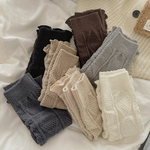 Chic Y2K cable knit leg warmers in various colors including charcoal, grey, and cream