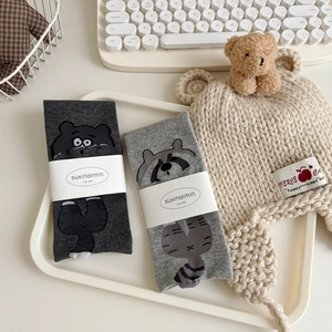 Cute cartoon raccoon mid-calf cotton socks in gray for women, presented in gift packaging