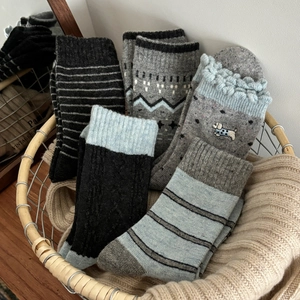 Thick wool blend winter socks set with stripes and dog embroidery in a vintage basket
