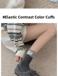 Detailed view of dark grey crew socks with mouse patch and contrast ribbed elastic cuffs