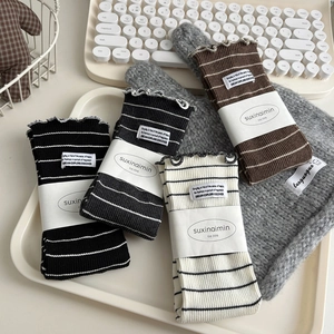 Cozy striped knit crew socks with lettuce edge and fabric label in four neutral colors