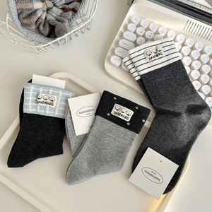 Three pairs of cotton crew socks with cartoon dog tags, stripes, and polka dot patterns