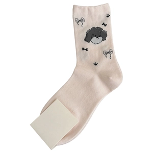 Cute Japanese style crew socks with cartoon puppy patterns and black bows on beige cotton