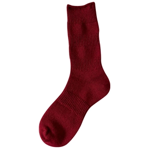Festive red wool blend mid-tube crew socks with vertical ribbed knit texture for winter