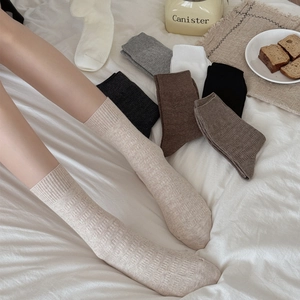 Vertical textured mid-calf socks for women in vintage earthy tones and warm knit design