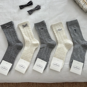 Five-pack women's knit crew socks in grey and white with bow detailing and embroidery