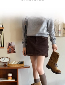 Detail of coffee brown corduroy skirt with lamb wool trim and matching brown socks