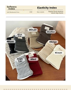 Close-up of ribbed knit leg warmers in multiple colors with cute animal fabric labels