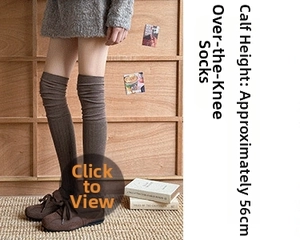 Detailed view of dark brown over-knee socks with vertical rib knit texture and 56cm height