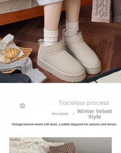 Close-up of cozy beige faux suede snow boots with thick wool lining on a wooden floor