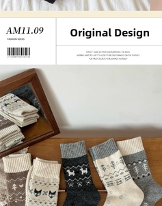 Detailed view of Fair Isle wool socks with Nordic patterns and animal embroidery motifs