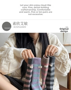 Detailed knit texture of wool socks with striped patterns and woven label tags