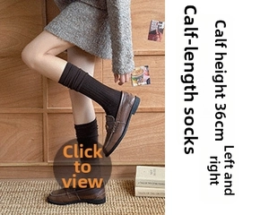 Detail of dark brown knitted slouch socks with vertical ribbing and 36cm height
