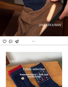 Detail of red and blue knitted socks with bear and heart patterns and brown sneakers
