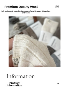 Close-up of cream wool socks featuring rib knit texture and a woven bread scone fabric label