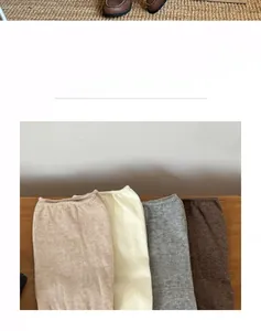 Detailed knit texture of solid color cotton crew socks in neutral earthy tones