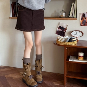 Knee-high cotton compression socks styled with corduroy skirt and brown leather boots