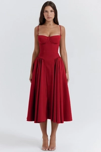 Detail of red bustier MIDI dress with thin straps and elegant pleated A-line skirt
