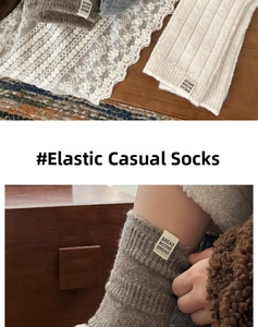 Detail of wool socks featuring thick knit texture and bread scone cloth label design