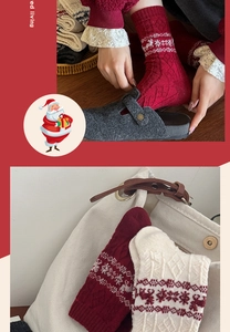 Detail of wool Fair Isle socks with reindeer patterns in red and cream knit fabric