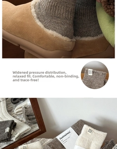 Detail of warm wool knit socks with vertical stripes and stitched label in earthy tones
