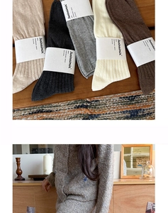 Detailed knit texture of solid color ribbed cotton socks in five classic neutral colors