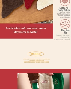 Detail of Christmas crew socks with festive embroidery and thick knit thermal fabric