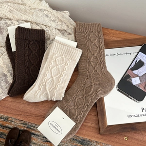Three pairs of vintage wool blend cable knit crew socks in brown and beige tones