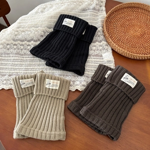 Chunky knit leg warmers in black, beige and coffee colors with stylish fabric tags