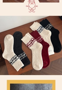 Detailed knit texture of Fair Isle wool socks with reindeer and snowflake patterns