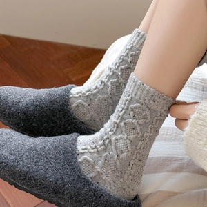 Women wool knit crew socks with argyle pattern paired with warm grey felt slippers