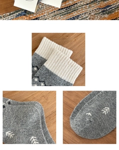 Detail of grey wool-blend socks featuring white tree jacquard pattern and ribbed cuffs