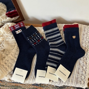 Set of four navy blue combed cotton socks with bear embroidery and stripe patterns