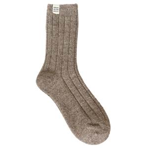Dark brown wool blend mid-calf ribbed socks with a small white woven brand label