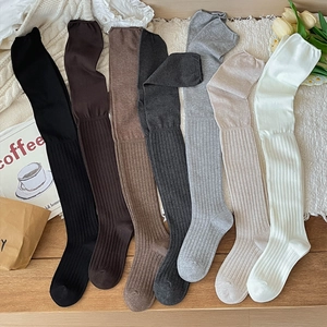 Set of 7 ribbed knit over-the-knee socks in solid colors like black, brown, and grey