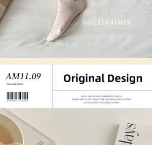 Detail of beige ribbed knit ballet style socks with bow accents and mesh texture
