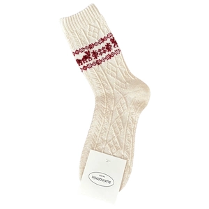 Fair Isle wool socks with reindeer pattern and cable knit texture in cream and red