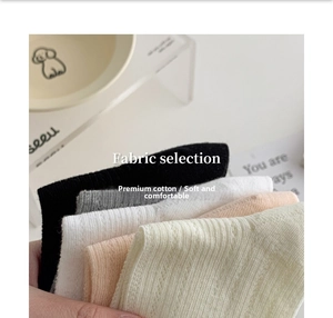 Close-up of knit texture on pastel bow ballet style mesh socks in various colors