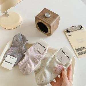 Three pairs of combed cotton low cut socks in grey pink and beige with speckled pattern