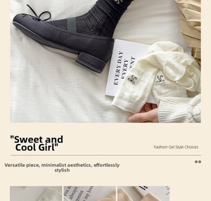 Close-up of ballet style bow socks with Mary Jane shoes and delicate letter embroidery