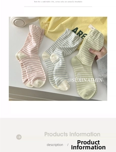 Detail of striped cotton crew socks in pastel pink, blue and green with ribbed cuffs