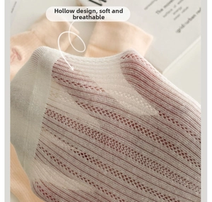 Close-up of soft breathable mesh fabric on white bow ballet style JK crew socks