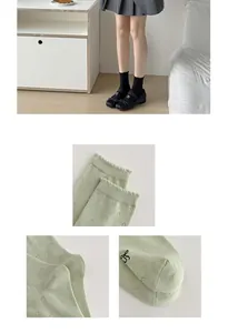 Detail of pointelle mesh mid-calf socks with cute bow and ruffled cuffs for women