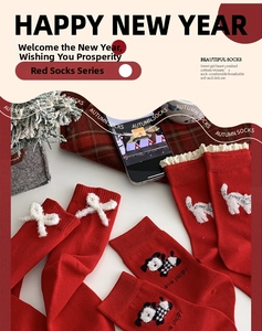 Close-up of red mid-calf socks with white 3D bows and cute festive animal patterns