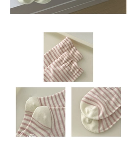 Detail shots of pink striped cotton socks showing ribbed cuffs and seamless toe stitches