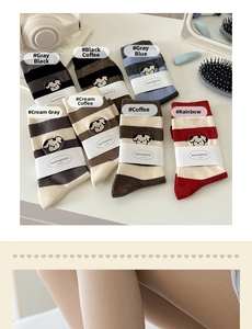Detailed view of mid-calf cotton socks with striped patterns and cute dog embroidery