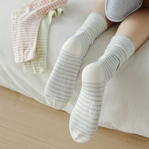 Pastel striped cotton crew socks for women featuring colorful patterns and bottom logos