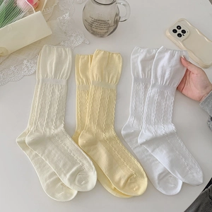 Three pairs of ballet style cotton mid-calf socks with cable knit and ruffled edges